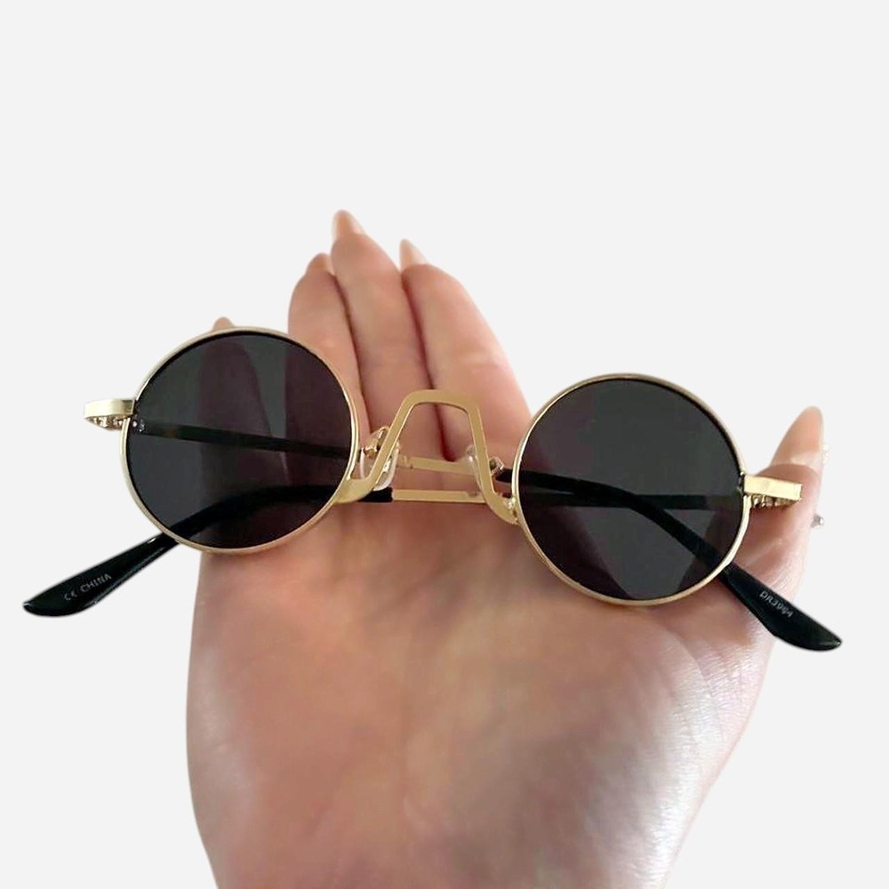 Gold color round sunglasses with black lenses